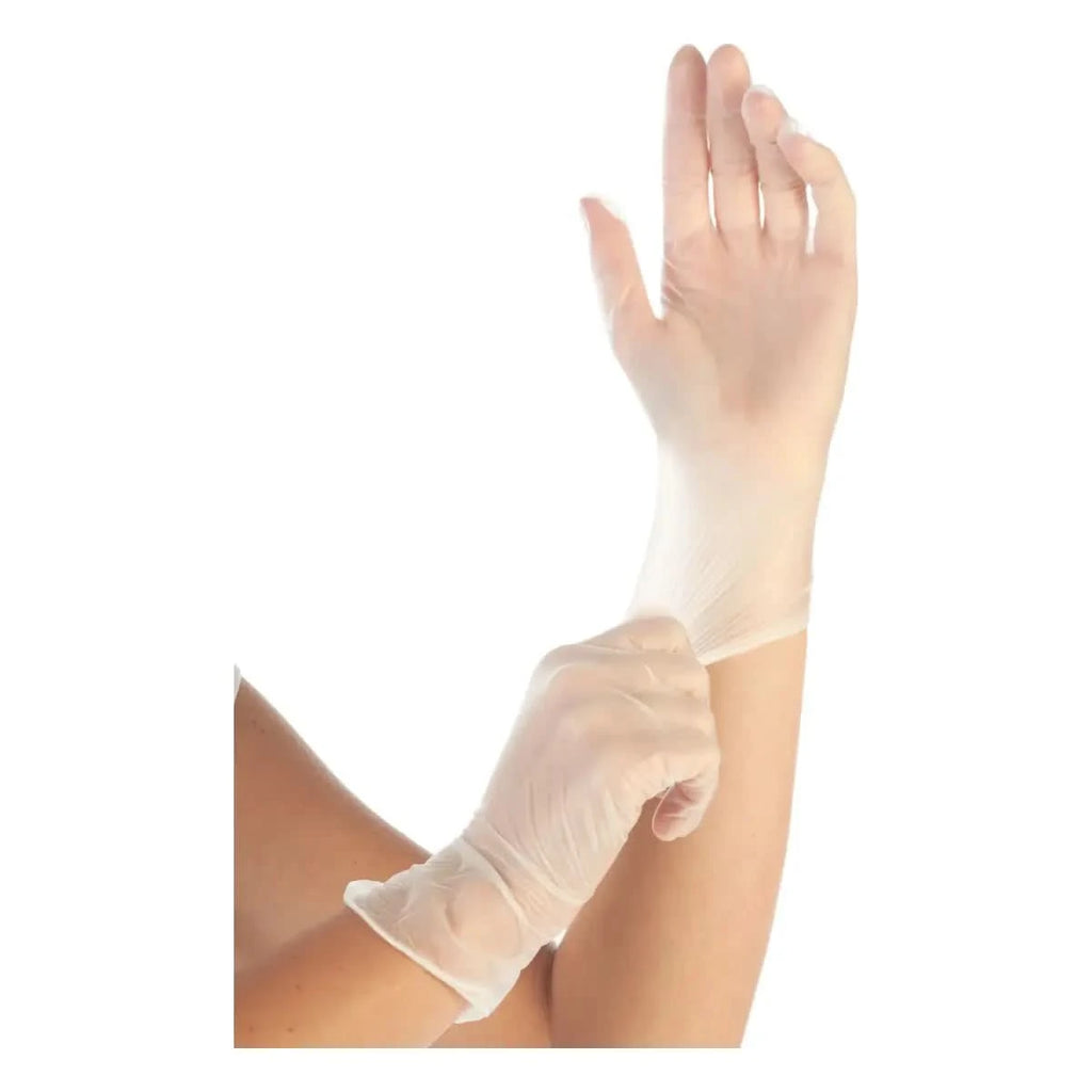 Eine hand trägt ein klarer, wegwerfbarer latexhandschuh von hygostar vinyl-handschuhe ideal 100 stück