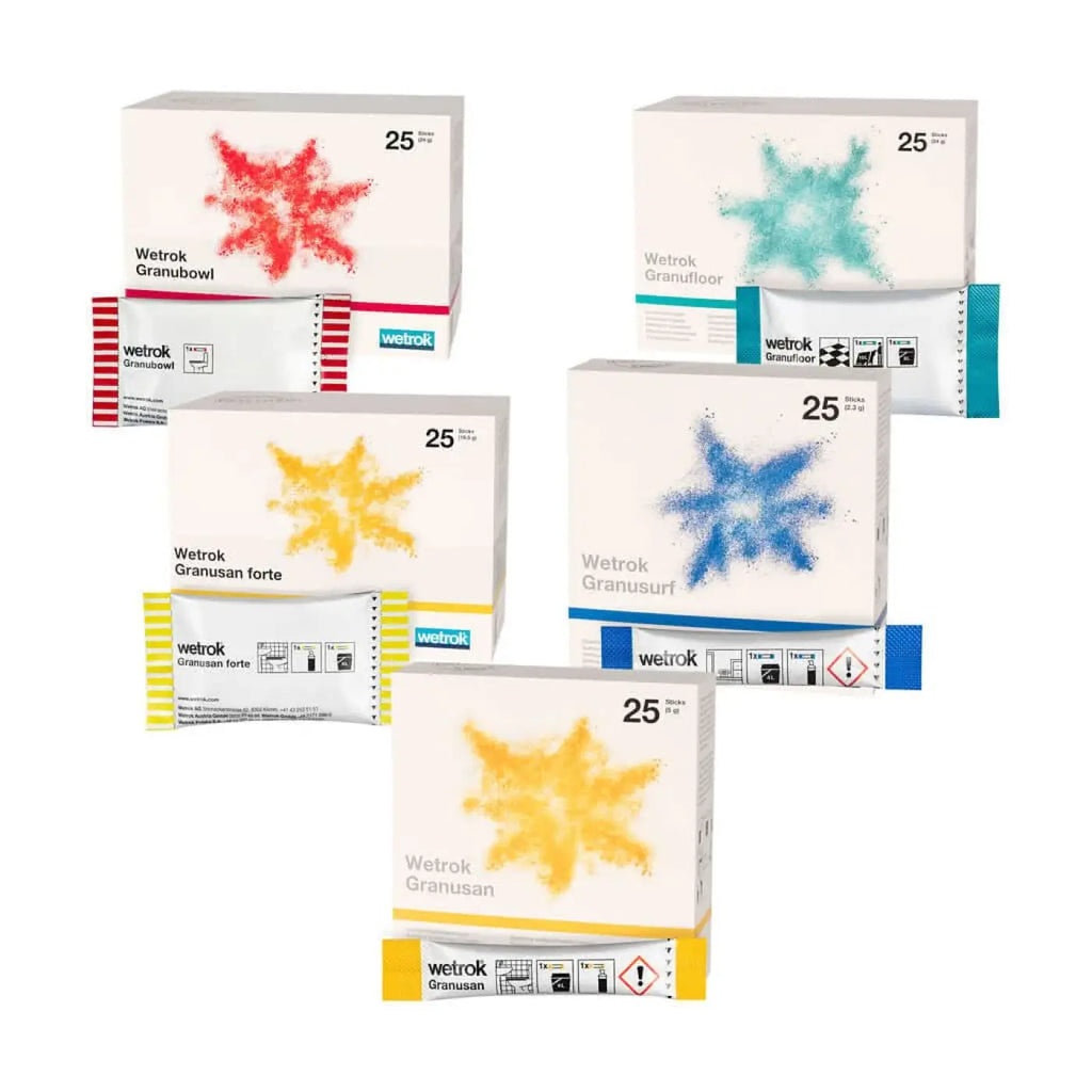 Weiße kartonboxen mit bunten sternmuster designs und wetrok 25g granulat für wetrok granusan sanitärreiniger sticks